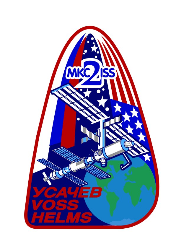 The International Space Station Expedition Two patch depicts the Space Station as it appears during the time the second crew will be on board. The Station flying over the Earth represents the overall reason for having a space station: to benefit the world through scientific research and international cooperation in space. The number 2 is for the second expedition and is enclosed in the Cyrillic MKS and Latin ISS which are the respective Russian and English abbreviations for the International Space Station. The United States and Russian flags show the nationalities of the crew indicating the joint nature of the program. When asked about the stars in the background, a crew spokesman said they "...represent the thousands of space workers throughout the ISS partnership who have contributed to the successful construction of our International Space Station."
