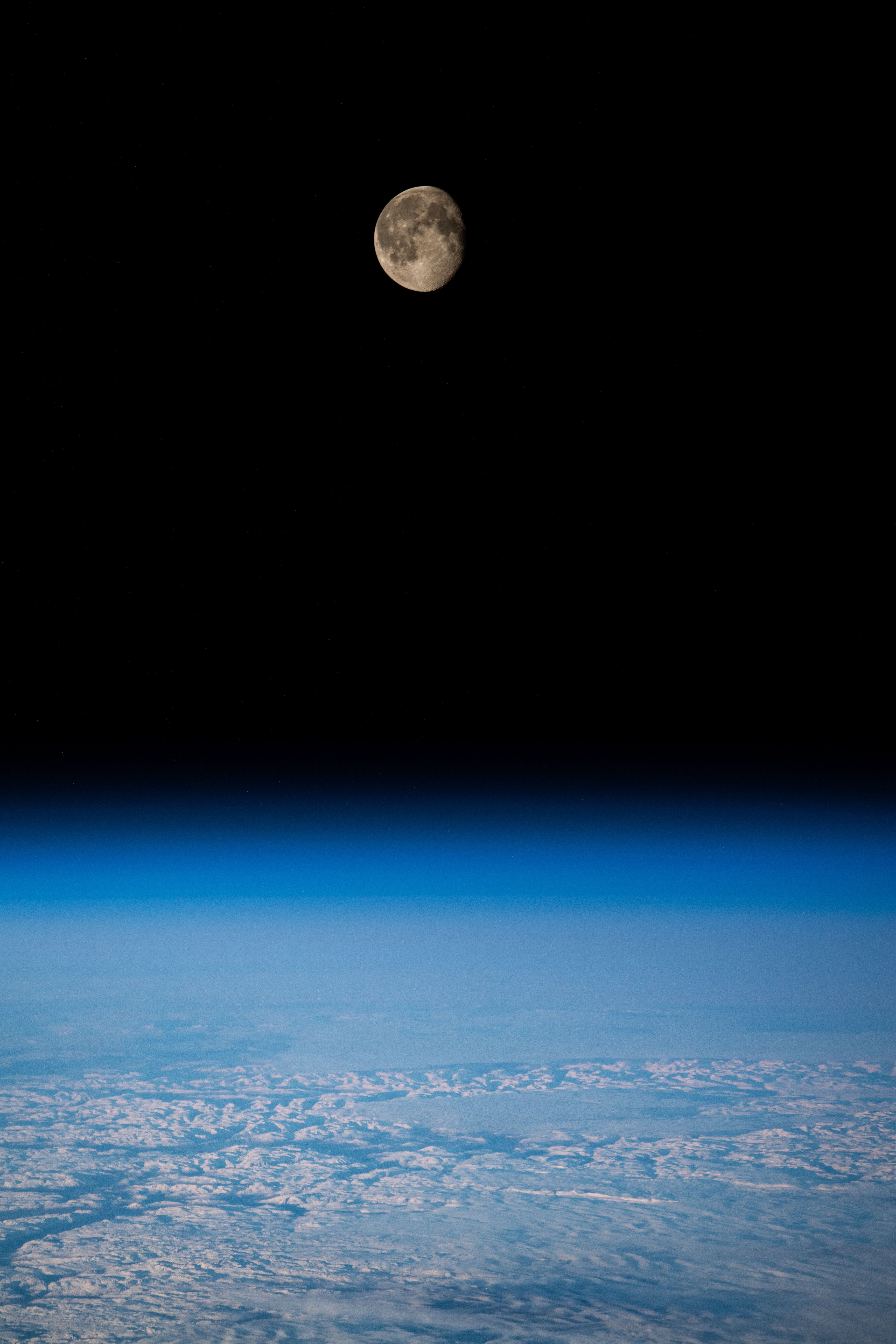 The waning gibbous Moon is pictured from the International Space Station as it orbited 262 miles above the Swiss Alps.