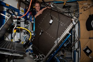 NASA astronaut and Expedition 70 Flight Engineer Loral O'Hara is pictured replacing hardware behind a life support rack inside the International Space Station's Tranquility module.