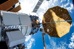 Northrop Grumman's Cygnus space freighter is pictured attached to the International Space Station while orbiting 264 miles above the Indian Ocean south of the island nation of Madagascar. At lower center, is the Canadarm2 robotic arm preparing to grapple Cygnus ahead of its removal from the Unity module and departure from the orbital outpost.