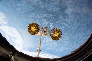 This view from the main window on the International Space Station's cupola shows Northrop Grumman's Cygnus space freighter in the grip of the Canadarm2 robotic arm moments before its release. The orbital complex was soaring 260 miles above the Atlantic Ocean off the Canadian island of Newfoundland at the time of this photograph.