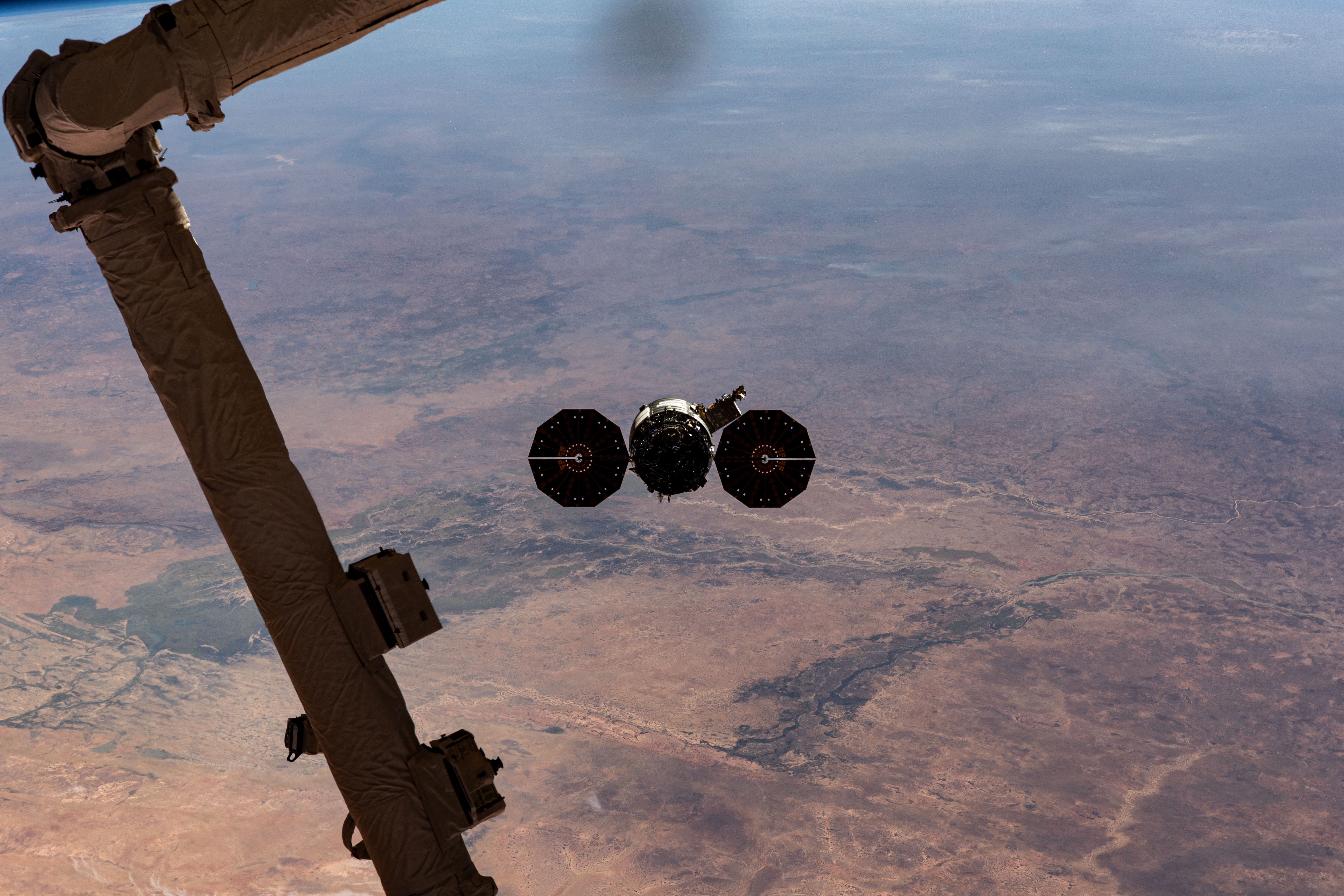 Northrop Grumman's Cygnus space freighter is pictured departing the International Space Station after it was released from the grip of the Canadarm2 robotic arm. The orbital complex was soaring 258 miles above the African nation of Mauritania at the time of this photograph. The major land feature toward the center left, is the Inner Niger Delta, an inland delta created by the Niger River in the central portion of Mali.
