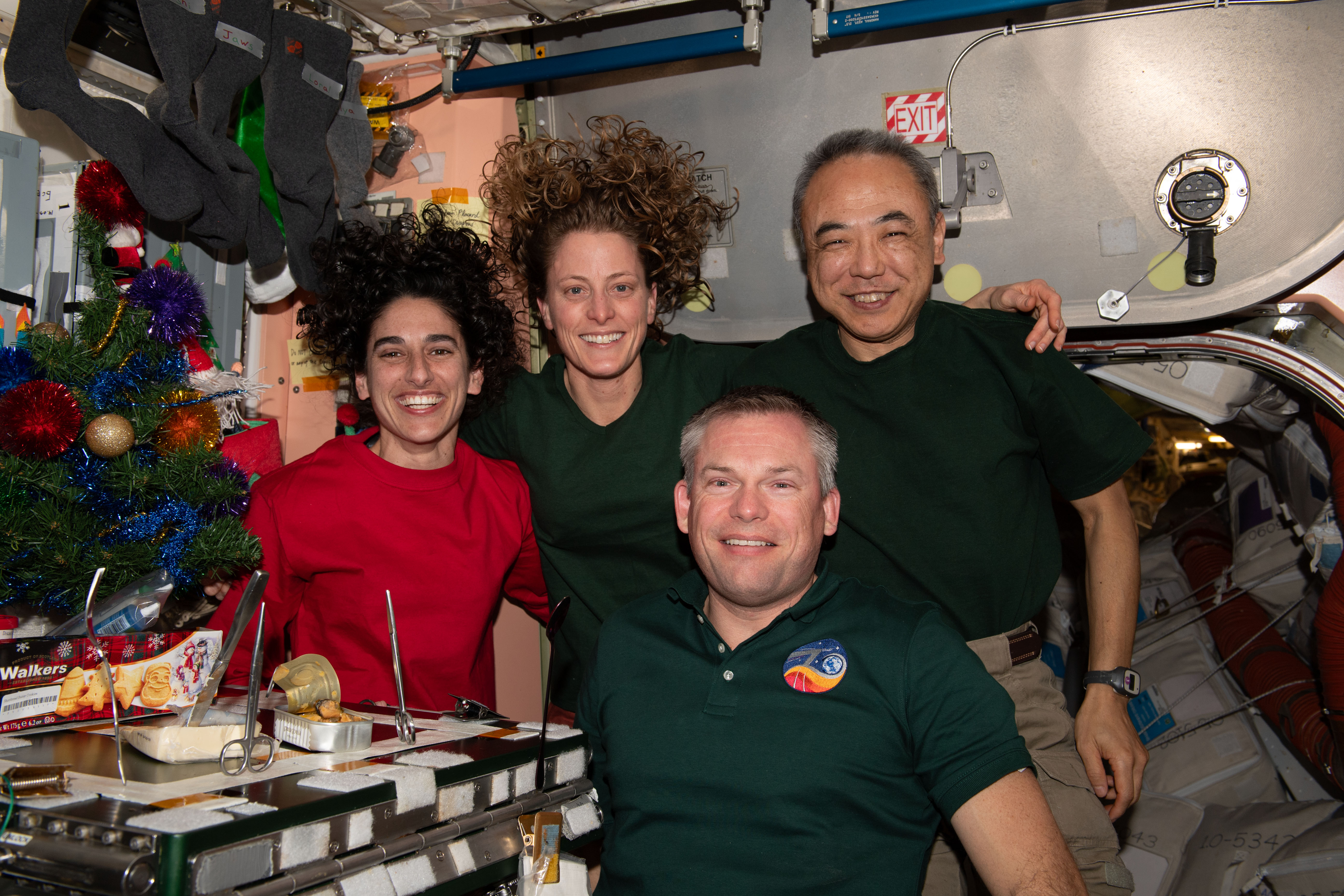 Four Expedition 70 crewmates join each other inside the International Space Station's Unity module for a Christmas Eve portrait. Clockwise from left are, NASA Flight Engineers Jasmin Moghbeli and Loral O'Hara; Flight Engineer Koichi Wakata from JAXA (Japan Aerospace Exploration Agency); and Commander Andreas Mogensen from ESA (European Space Agency).