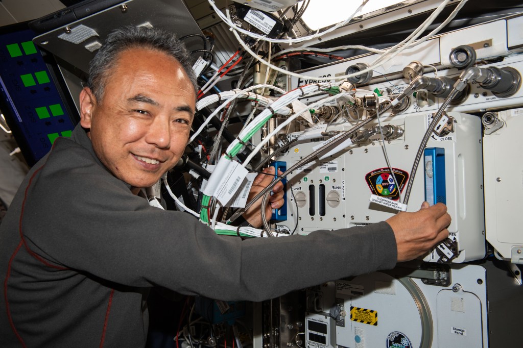 Expedition 69 Flight Engineer and JAXA (Japan Aerospace Exploration Agency) astronaut Satoshi Furukawa removes experiment hardware from inside the Multi-use Variable-g Platform, a biology research device that can generate artificial gravity inside the International Space Station's Kibo laboratory module.