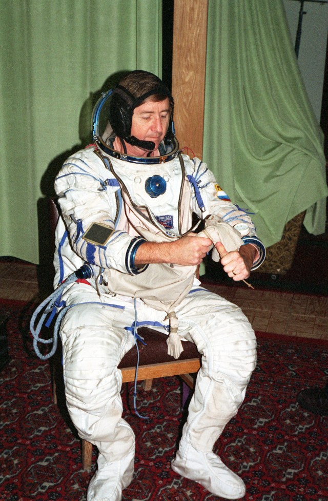 Astronaut Frank L. Culbertson, Jr., dons a training version of the Sokol cosmonaut suit prior to a training session at the Gagarin Cosmonaut Training Center in Russia. Culbertson is in training as commander for Expedition Three. He was named to that position in September of this year.