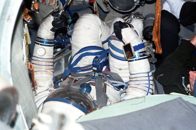 Astronaut Frank L. Culbertson, Jr., attired in a training version of the Sokol cosmonaut suit, participates in a training session in a full-scale Soyuz trainer at the Gagarin Cosmonaut Training Center in Russia. Culbertson is in training as commander for Expedition Three. He was named to that position in September of this year.