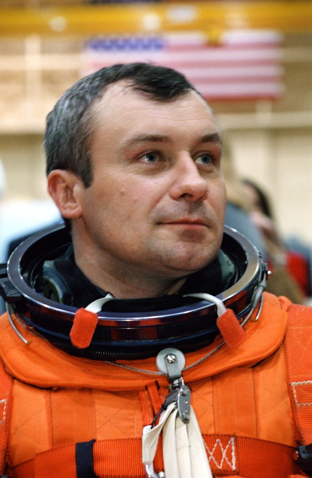 Cosmonaut Vladimir N. Dezhurov, Expedition Three flight engineer, attired in a training version of the shuttle launch and entry garment, is photographed prior to a mission training session in the Systems Integration Facility at Johnson Space Center (JSC). Dezhurov, minutes later, was seated along with his crew mates on the mid deck of one of the high fidelity trainers/mockups. Dezhurov is affiliated with Rosaviakosmos. The Expedition Three crew is scheduled to launch aboard the Space Shuttle Discovery this summer to begin a lengthy stay onboard the International Space Station (ISS).