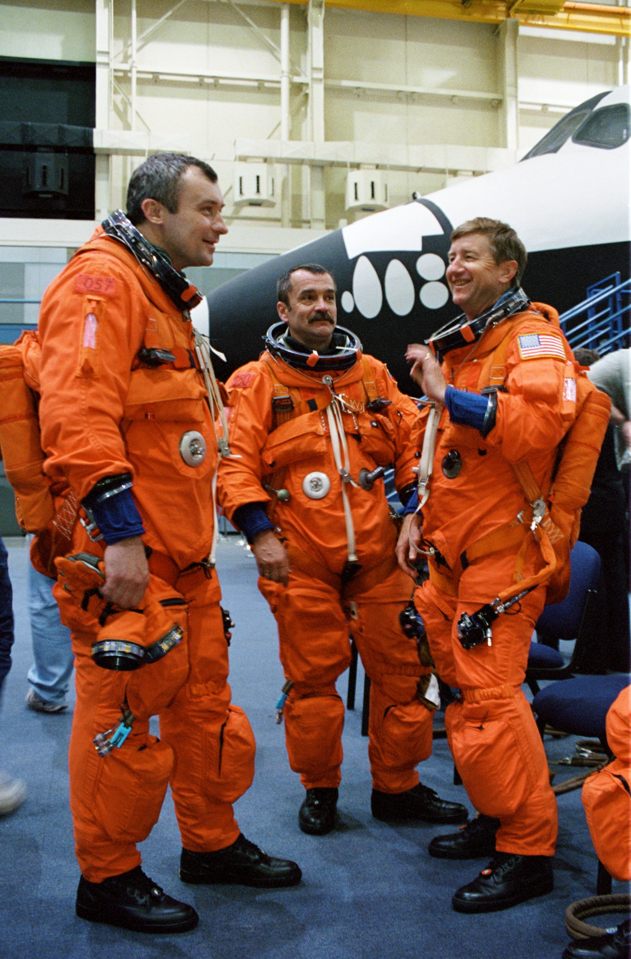 Cosmonauts Vladimir N. Dezhurov (left) and Mikhail Tyurin, Expedition Three flight engineers; and astronaut Frank L. Culbertson, Jr., Expedition Three commander, are photographed during mission training in the Johnson Space Center’s Systems Integration Facility. Dezhurov and Tyurin represent Rosaviakosmos.