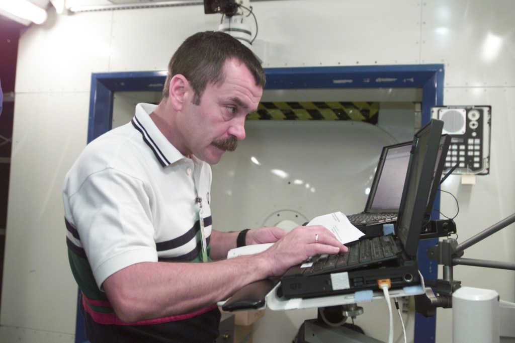 Cosmonaut Mikhail Tyurin, Expedition Three flight engineer representing Rosaviakosmos, is photographed during Human Research Facility (HRF) Rack training in the International Space Station (ISS) Destiny laboratory mockup/trainer at the Johnson Space Center’s Systems Integration Facility.