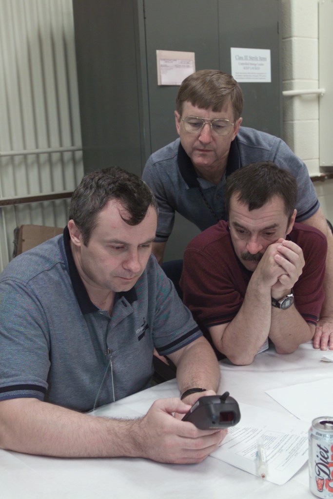 JSC2001-E-16669 (10 May 2001) --- Cosmonaut Vladimir N. Dezhurov (left), Expedition Three flight engineer, Frank L. Culbertson, Jr., Expedition Three mission commander, and Mikhail Tyurin, Expedition Three flight engineer, participate in biomedical training in the Bioengineering and Test Support Facility at Johnson Space Center (JSC). Dezhurov and Tyurin are affiliated with Rosaviakosmos.