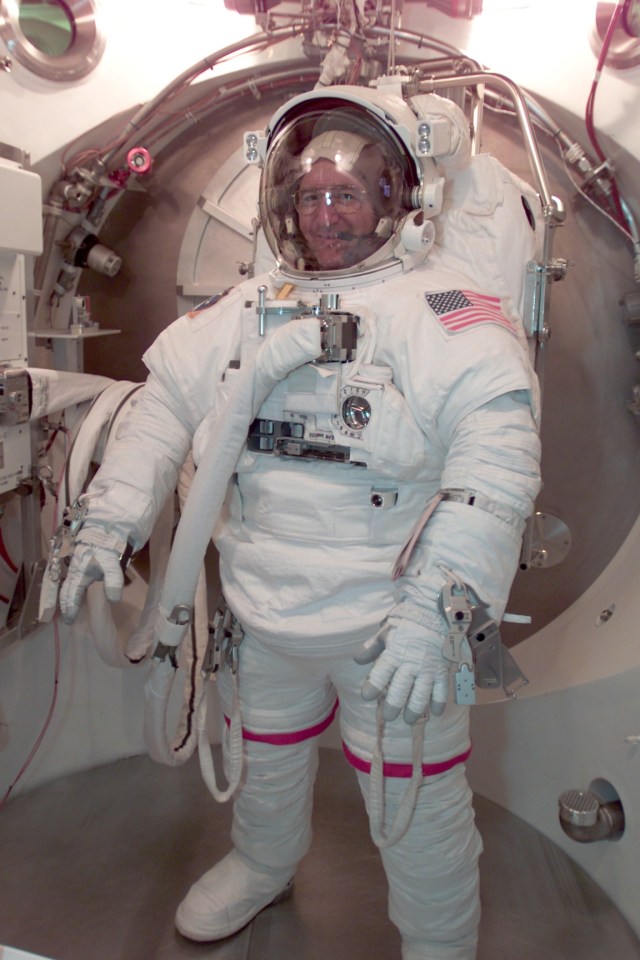 Astronaut Frank L. Culbertson, Jr., Expedition Three commander, participates in an Extravehicular Mobility Unit (EMU) fit check in a Space Station Airlock Test Article (SSATA) in the Crew Systems Laboratory at the Johnson Space Center (JSC).