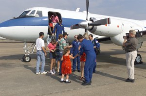 The STS-105 and Expedition Two crews step off of the Gulfstream I aircraft and meet their families during the crew return ceremonies at Ellington Field. The STS-105 crew delivered the Expedition Three crew and supplies to the International Space Station (ISS) and brought the Expedition Two crew back to Earth.