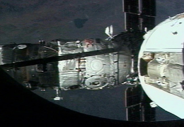 The Russian Docking Compartment, named Pirs (the Russian word for pier), docks with the International Space Station (ISS). One of the Expedition Three crew members, using a video camera, recorded the rendezvous and docking from onboard the orbital outpost. The Pirs vehicle was launched on September 14, 2001 and docking occurred on September 16.