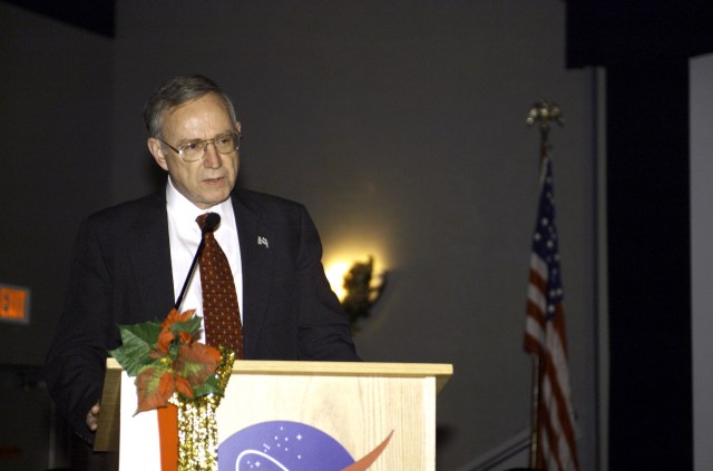 Tommy W. Holloway, manager, Space Shuttle Program, speaks from the lectern in the ballroom of the Gilruth Center at Johnson Space Center (JSC) during the Expedition Three Welcome Home ceremony.