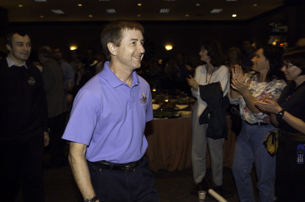 JSC2001-E-45024 (20 December 2001) --- Astronaut Frank L. Culbertson, Jr., Expedition Three mission commander, is pictured in the ballroom of the Gilruth Center at Johnson Space Center (JSC) during the Expedition Three Welcome Home ceremony. Cosmonaut Vladimir N. Dezhurov, flight engineer representing Rosaviakosmos, is visible in background.