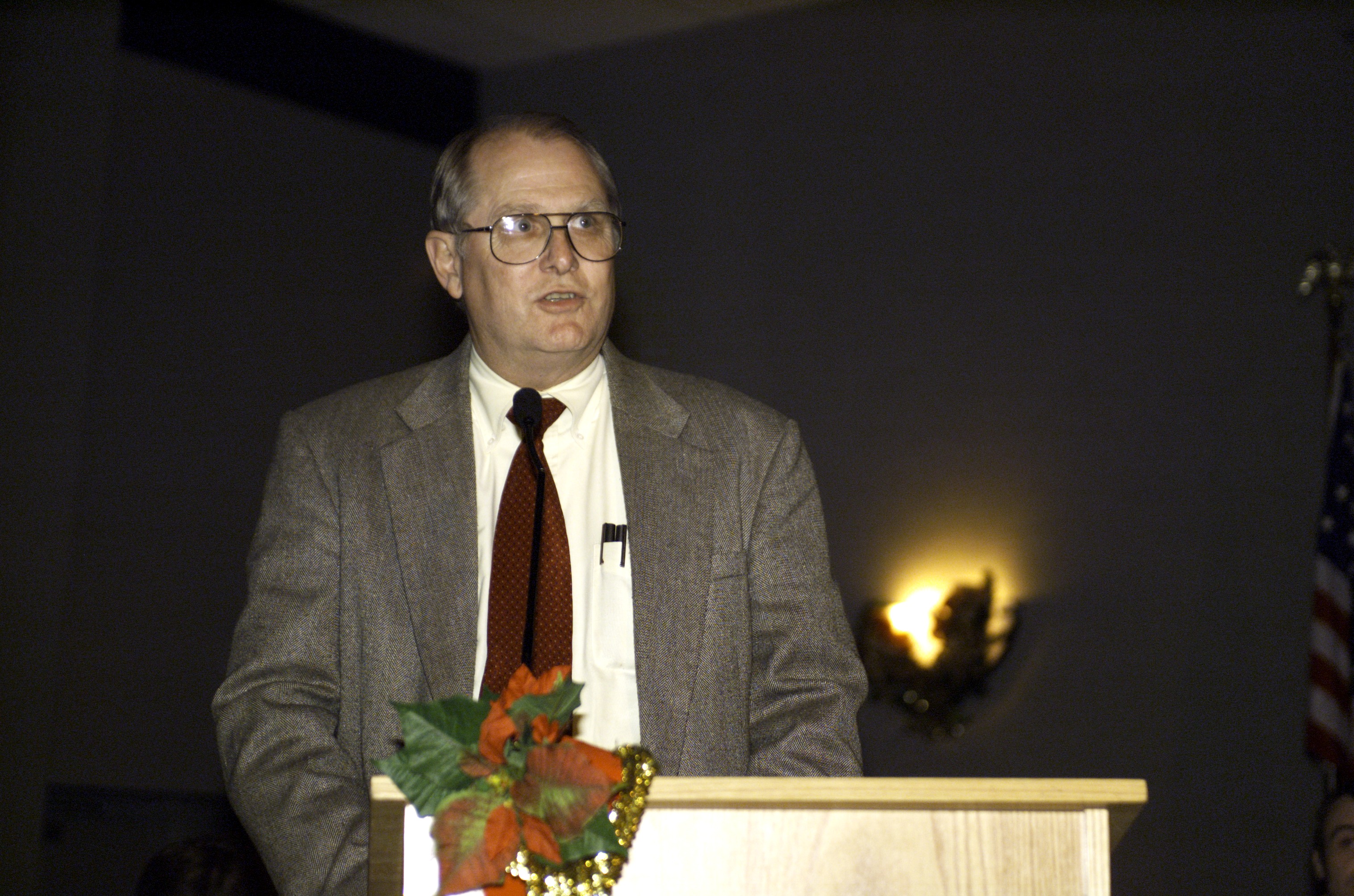 JSC2001-E-45028 (20 December 2001) --- Johnson Space Center’s (JSC) Deputy Director Randy Stone speaks from the lectern in the ballroom of the Gilruth Center at JSC during the Expedition Three Welcome Home ceremony.