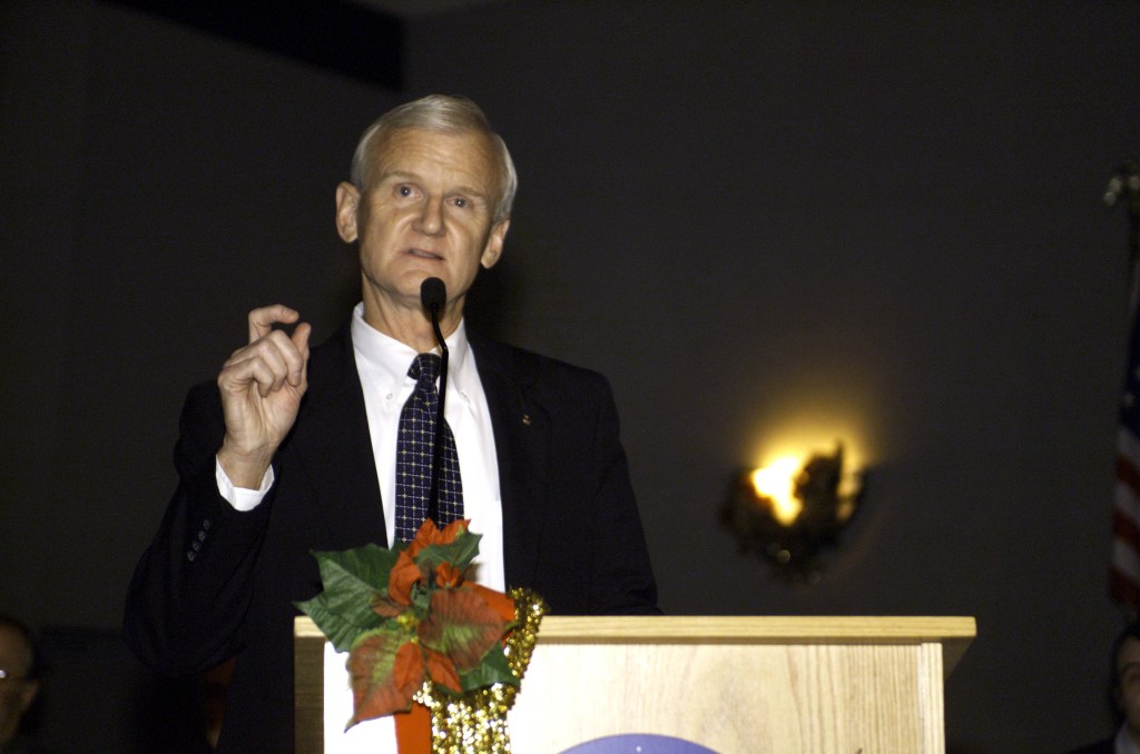 John H. Casper, Director of Safety, Reliability, and Quality Assurance Office, speaks from the lectern in the ballroom of the Gilruth Center at Johnson Space Center (JSC) during the Expedition Three Welcome Home ceremony.