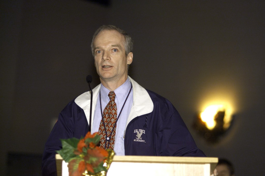 Charles J. Precourt, Chief, Astronaut Office, speaks from the lectern in the ballroom of the Gilruth Center at Johnson Space Center (JSC) during the Expedition Three Welcome Home ceremony.