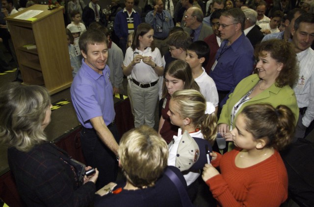 Astronaut Frank L. Culbertson, Jr. (right), Expedition Three mission commander, greets guests in the ballroom of the Gilruth Center at Johnson Space Center (JSC) during the Expedition Three Welcome Home ceremony.