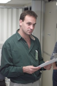 Soyuz 4 Flight Participant Mark Shuttleworth, a South African businessman flying to the International Space Station (ISS) under a private commercial agreement with the Russian Aviation and Space Agency (Rosaviakosmos), listens to briefing in the Johnson Space Center's Space Station Training Facility (SSTF). The Soyuz 4 prime and backup crews have toured several other JSC facilities this week, with yet others scheduled. The prime crew members will launch in late April from the Baikonur Cosmodrome, Kazakhstan, to deliver a fresh Soyuz spacecraft to the station for use as a lifeboat. After spending about a week aboard the outpost, they will return to Earth aboard the Soyuz.