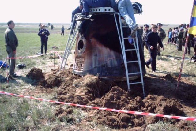 This post-landing scene shows to what extent the ground was affected by the soft-landing thrusters of the Soyuz TM-33 spacecraft following its touchdown in Kazakhstan, bringing to a successful conclusion the Soyuz 4 taxi mission. Crew members for the 10-day flight, much of which was spent onboard the International Space Station (ISS) were Yuri Gidzenko, commander; Roberto Vittori, flight engineer; and space flight participant Mark Shuttleworth of South Africa. Gidzenko is with Rosaviakosmos and Vittori represents the European Space Agency (ESA). Photo Credit: NASA/Marty Linde