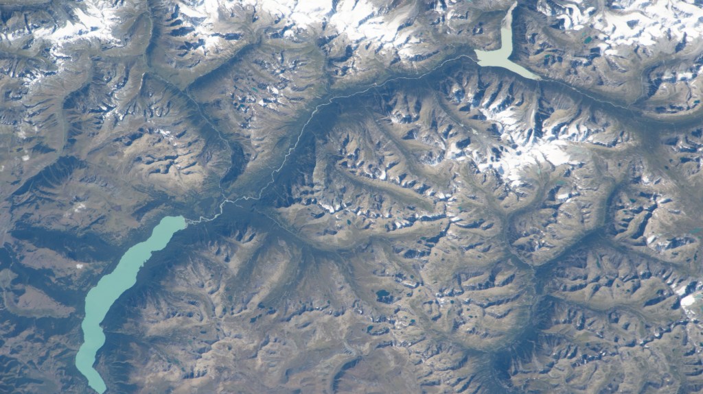 Ka Nasi Lake (lower left) and Ake Kule Lake (upper right), in China's Altai Mountain range near Mongolia's far western border, are pictured in this photograph as the International Space Station orbited 265 miles above.