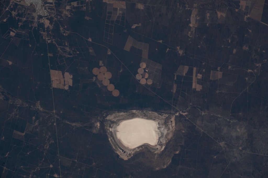 Lake Salinas del Bebedero rests southwest of San Luis, Argentina (upper left), in this photograph from the International Space Station as it orbited 269 miles above. The area pictured lies at the foot of the Sierra Grande Mountains in the temperate grassland region of central Argentina.