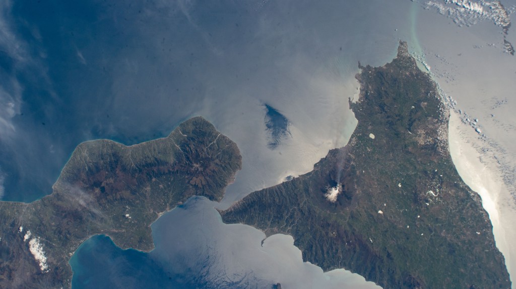 Mount Etna, an active stratovolcano on Italy's island of Sicily, billows smoke in this photograph from the International Space Station as it orbited 262 miles above.