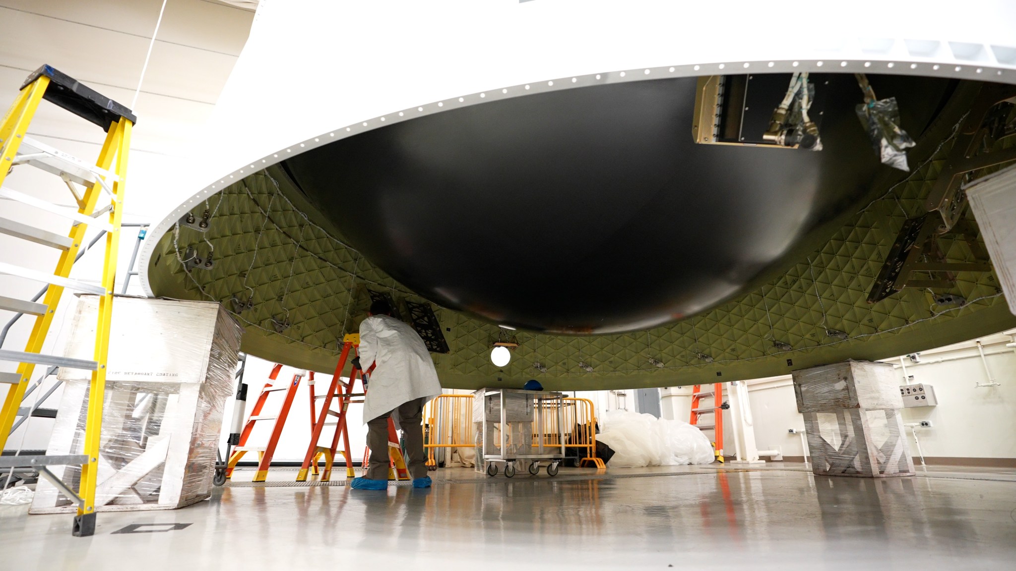 Engineers at NASA’s Marshall Space Flight Center flip the Artemis II Orion stage adapter for installation of its diaphragm Nov. 30.