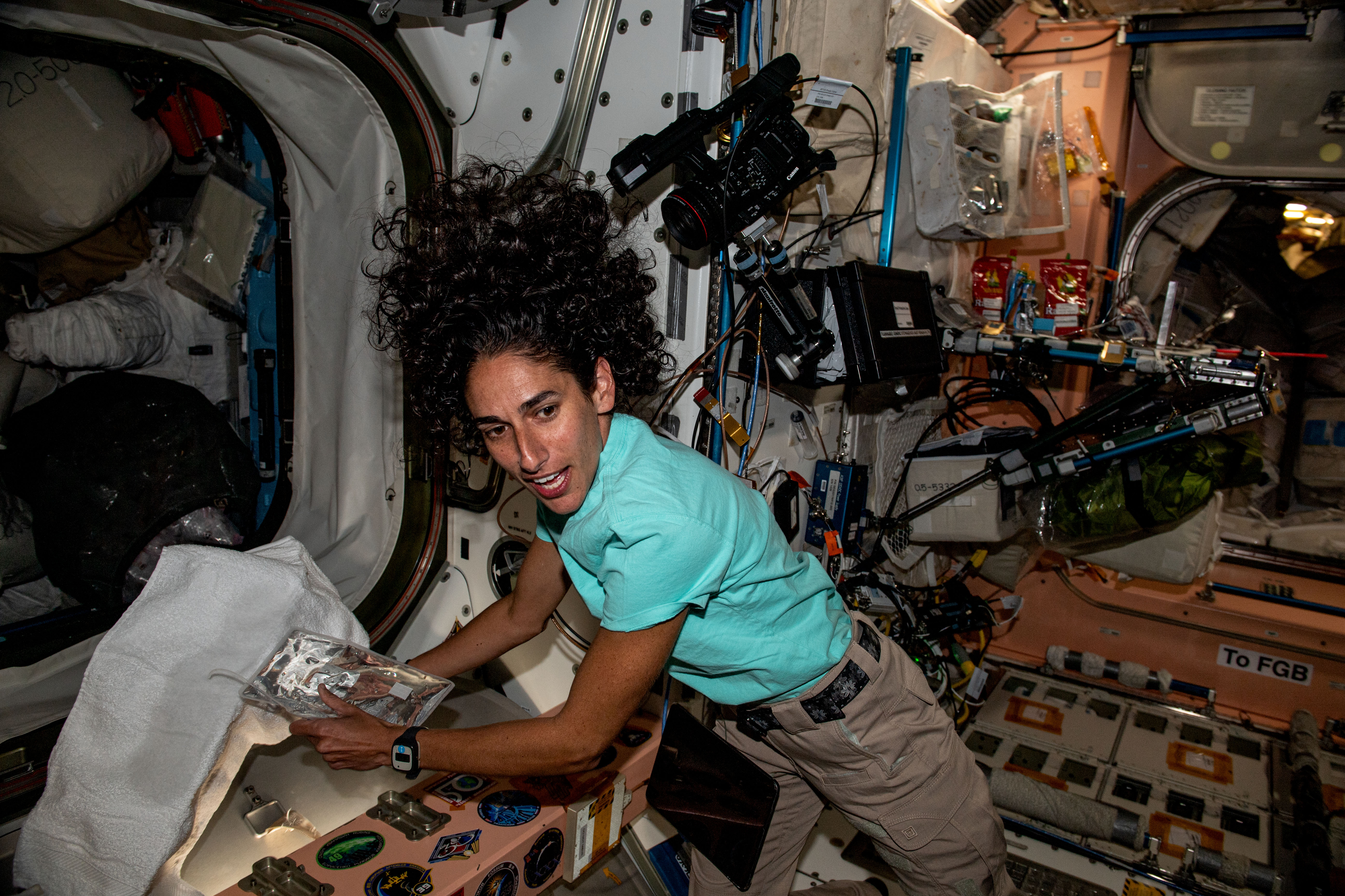 NASA astronaut Jasmin Moghbeli is one of the International Space Station's newest crew members having been aboard the orbital lab for only two days when this photograph was taken. Moghbeli is pictured inside the Unity module familiarizing herself with station systems.