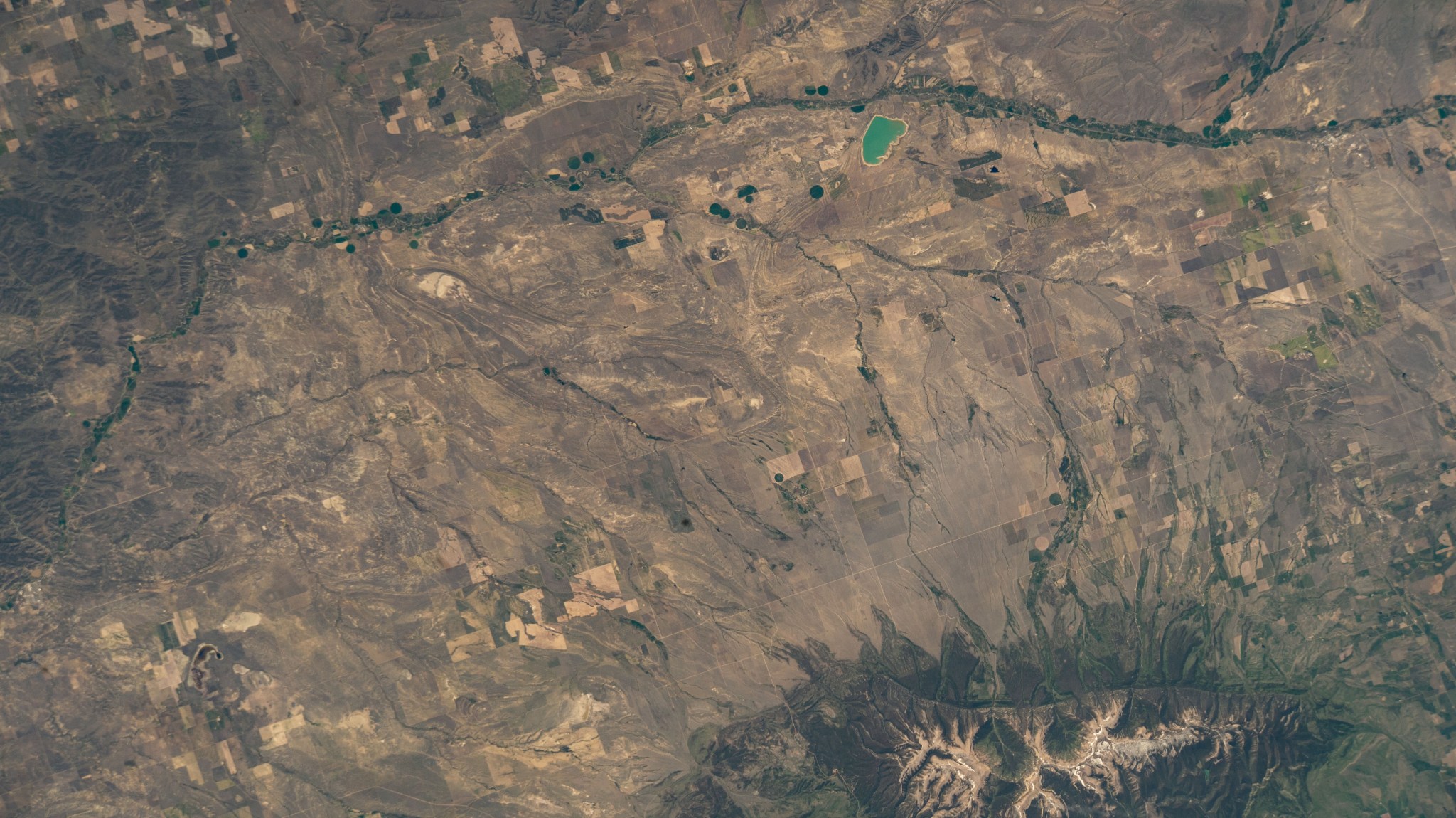 Old Baldy Mountain peak (bottom right) and Dead Man's Basin Reservoir (top) in Montana are pictured from the International Space Station as it orbited 264 miles above North America.