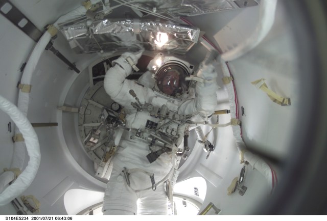 A crew member used a digital still camera to take a picture of astronaut James F. Reilly in the airlock at the completion of the final STS-104 extravehicular activity (EVA).