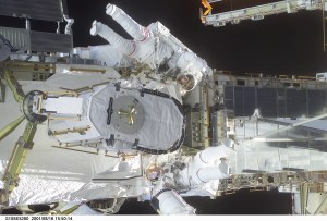 STS105-E-5280 (16 August 2001) --- Astronauts Daniel T. Barry (with red stripes on suit) and Patrick G. Forrester work with the Early Ammonia Servicer (EAS), which they are in the process of installing on a segment of the P6 structure on the International Space Station (ISS). The two mission specialists were participating in the first of two scheduled STS-105 space walks. The image was recorded with a digital still camera.