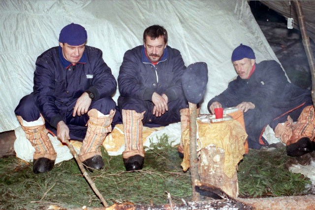 Members of the third crew that will live aboard the International Space Station, from left Pilot Vladimir Dezhourov from Russia; Flight Engineer Mikhail Tyurin from Russia; and Commander Ken Bowersox, a U.S. astronaut, participate in Soyuz winter survival training in March 1998 near Star City, Russia. The training prepares the crew in the event the Soyuz spacecraft, used as an emergency crew return "lifeboat" for the station, were to land in a location where the crew could not be immediately reached.
