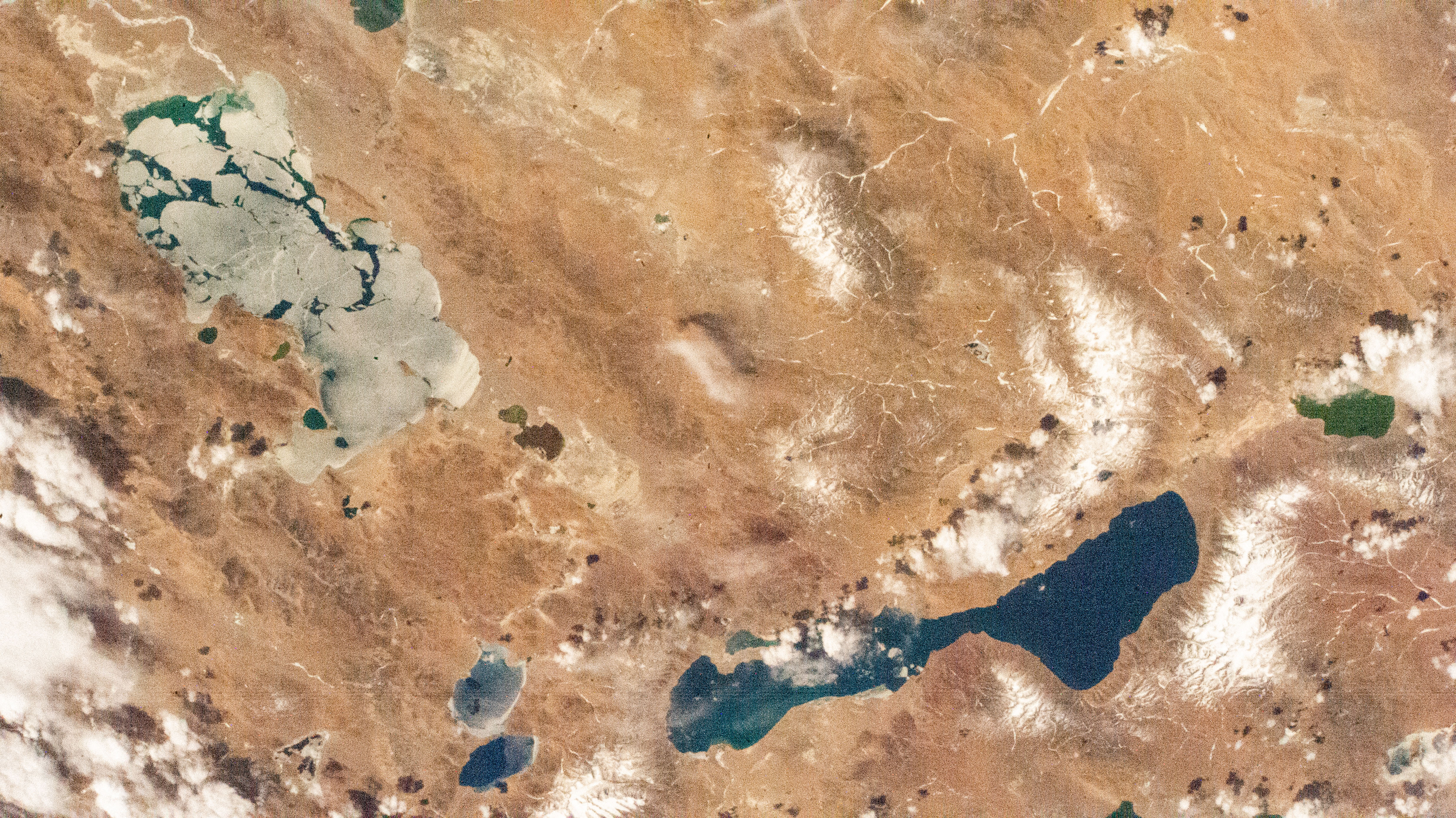 Salt lakes in southern China near the Himalayas are pictured by an external high definition camera on the International Space Station as it orbited 261 miles above.