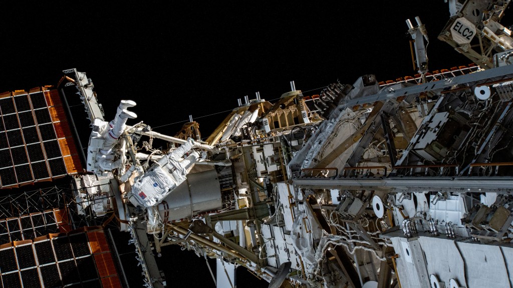 NASA astronaut Stephen Bowen and UAE (United Arab Emirates) astronaut Sultan Alneyadi are pictured in their Extravehicular Mobility Units, or spacesuits, on the International Space Station's starboard truss structure during a spacewalk. The duo would spend seven hours and one minute in the vacuum of space routing cables and installing insulation readying the orbital outpost for its next set of roll-out solar arrays due to be installed after their delivery on the next SpaceX Dragon cargo mission.
