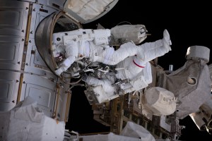 NASA astronaut Stephen Bowen and UAE (United Arab Emirates) astronaut Sultan Alneyadi are pictured in their Extravehicular Mobility Units, or spacesuits, exiting the International Space Station's Quest airlock and beginning a spacewalk. The duo would spend seven hours and one minute in the vacuum of space routing cables and installing insulation readying the orbital outpost for its next set of roll-out solar arrays due to be installed after their delivery on the next SpaceX Dragon cargo mission.