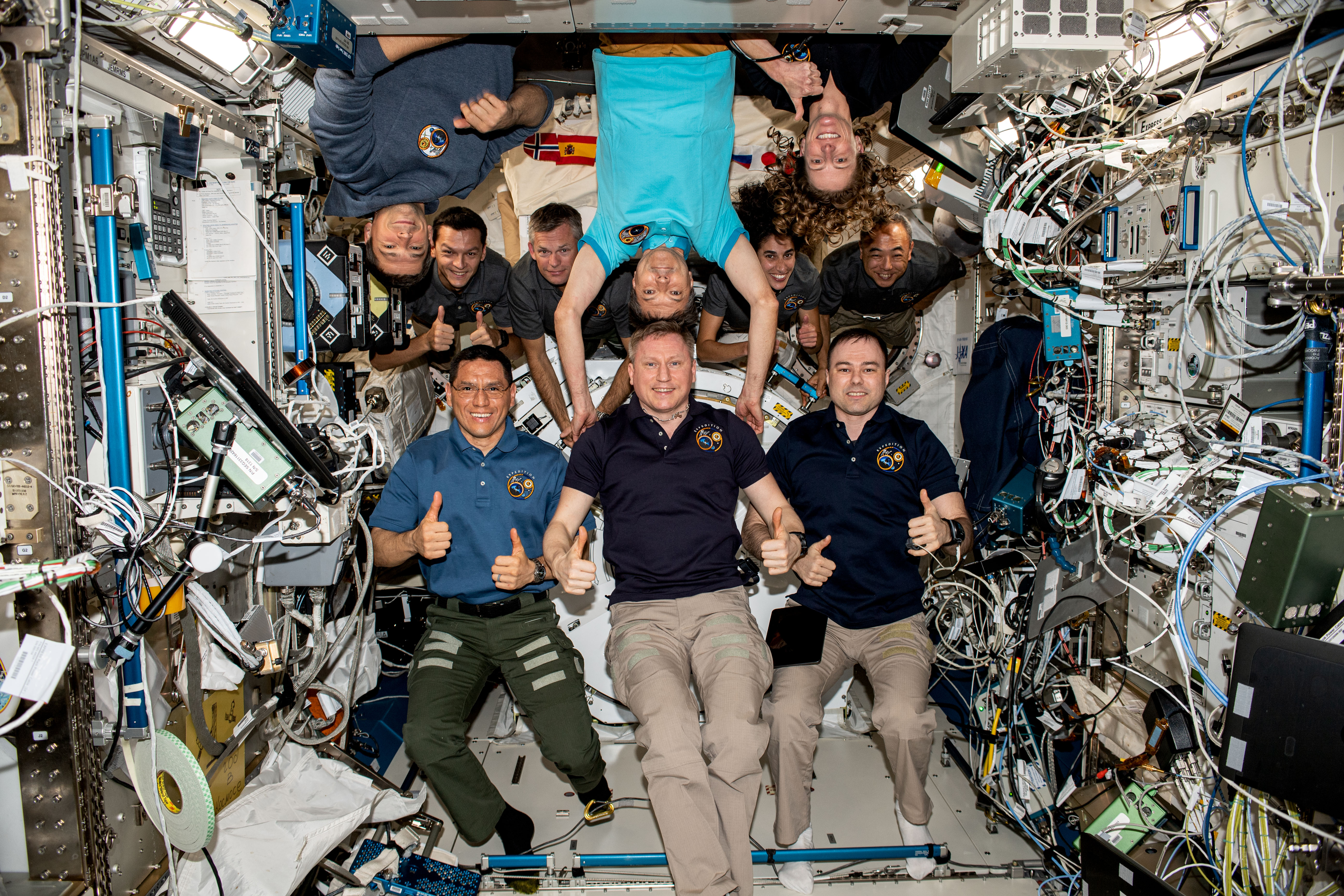 In the bottom row, is the homebound trio Expedition 69 trio with (from left) NASA astronaut Frank Rubio and Roscosmos cosmonauts Sergey Prokopyev and Dmitri Petelin. The threesome was pictured after reaching 365 days, or one year, in space aboard the International Space Station. They departed the station inside the Soyuz MS-23 crew ship on Sept. 27, 2023, after 371 days living in Earth orbit. In the top row, are the seven crew members who will stay aboard the orbiting lab until spring 2024 as Expedition 70 crew members. From left are, Roscosmos cosmonauts Nikolai Chub and Konstantin Borisov; ESA (European Space Agency) astronaut Andreas Mogensen; Roscosmos cosmonaut Oleg Kononenko; NASA astronauts Jasmin Moghbeli and Loral O'Hara; and JAXA (Japan Aerospace Exploration Agency) astronaut Satoshi Furukawa.