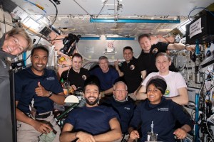 The Axiom Mission-2 and Expedition 69 crew members pose for a portrait together during dinner time aboard the International Space Station. In the center front row, is Expedition 69 crew member and UAE (United Arab Emirates) astronaut Sultan Alneyadi flanked by (from left) Axiom Mission-2 crew members Commander Peggy Whitson, Mission Specialist Ali Alqarni, Pilot John Shoffner, and Mission Specialist Rayyanah Barnawi. In the back (from left) are, Expedition 69 crew members Roscosmos cosmonaut Dmitri Petelin, NASA astronaut Stephen Bowen, Roscosmos cosmonauts Andrey Fedyaev and Sergey Prokopyev, and NASA astronaut Woody Hoburg. Not pictured is NASA astronaut Frank Rubio.