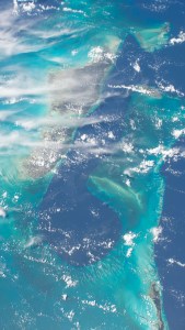 The teal and deep blue waters of The Bahamas are seen from the International Space Station as it orbited roughly 260 miles above. To the left of the image, the Andros island can be seen, while Nassau is shown to to the right.