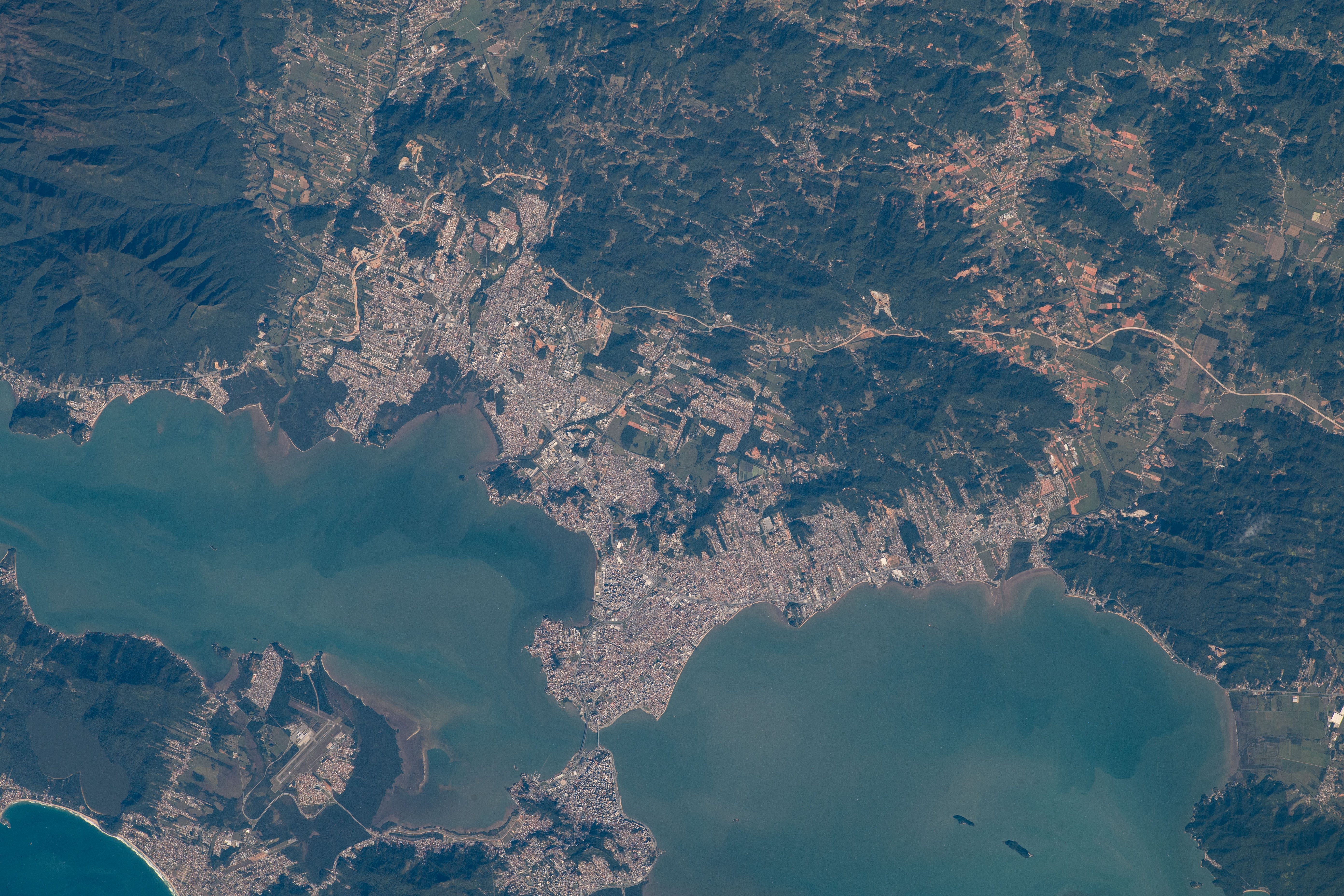The cities of San Jose (top) and Floriana (bottom) in Brazil are bridged together in between the North and South Bays in this photograph from the International Space Station as it orbited 264 miles above.