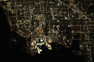 The city lights of Los Angeles, California, and its surrounding suburbs, are pictured from the International Space Station as it orbited 261 miles above. Terminal Island, an artificial island containing the ports of Los Angeles and Long Beach, is featured prominently at the bottom center of this photograph.