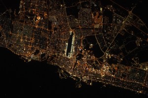 The city lights of Sharjah and Dubai in the United Arab Emirates, with Dubai International Airport (center) next to the Ras Al Khor Wildlife Sanctuary (dark area), are pictured from the International Space Station as it orbited 262 miles above.