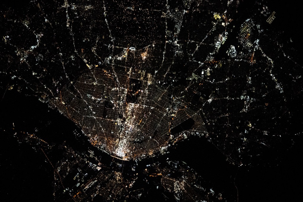 The city lights of St. Louis, Missouri, and its suburbs, fan out west of the Mississippi River in this photograph from the International Space Station as it orbited 262 miles above. The Mississippi separates the Show-Me State from the Prairie State of Illinois.