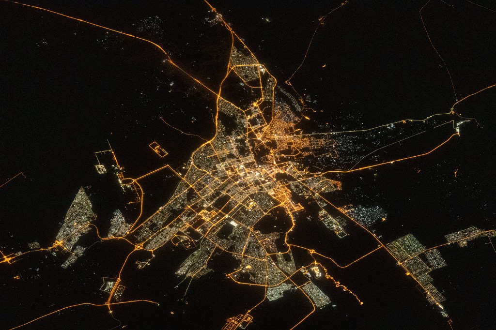 The city lights of the oasis city of Al Ain in the United Arab Emirates are pictured from the International Space Station as it orbited 260 miles above southern Iran near the coast of the Strait of Hormuz.