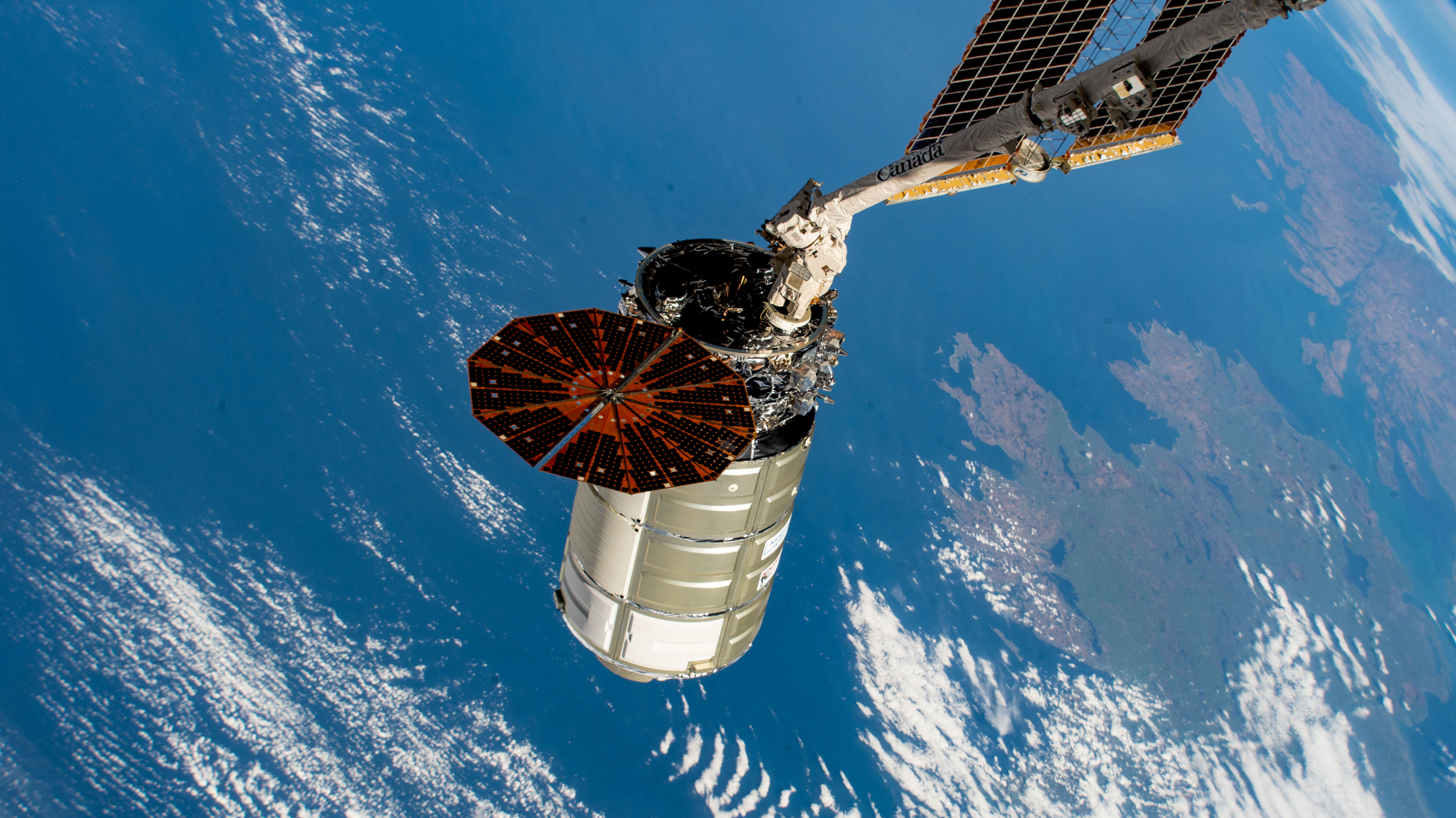 The Cygnus space freighter from Northrop Grumman is poised for release from the Canadarm2 robotic arm as the International Space Station orbited 263 miles above the Atlantic Ocean off the coast of Ireland.