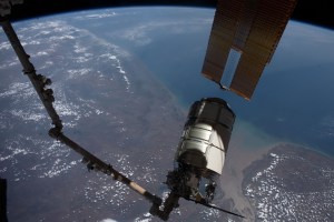 The Cygnus space freighter from Northrop Grumman is pictured in the grips of the Canadarm2 robotic arm as the International Space Station orbited 258 miles above the Arabian Sea coast of India.