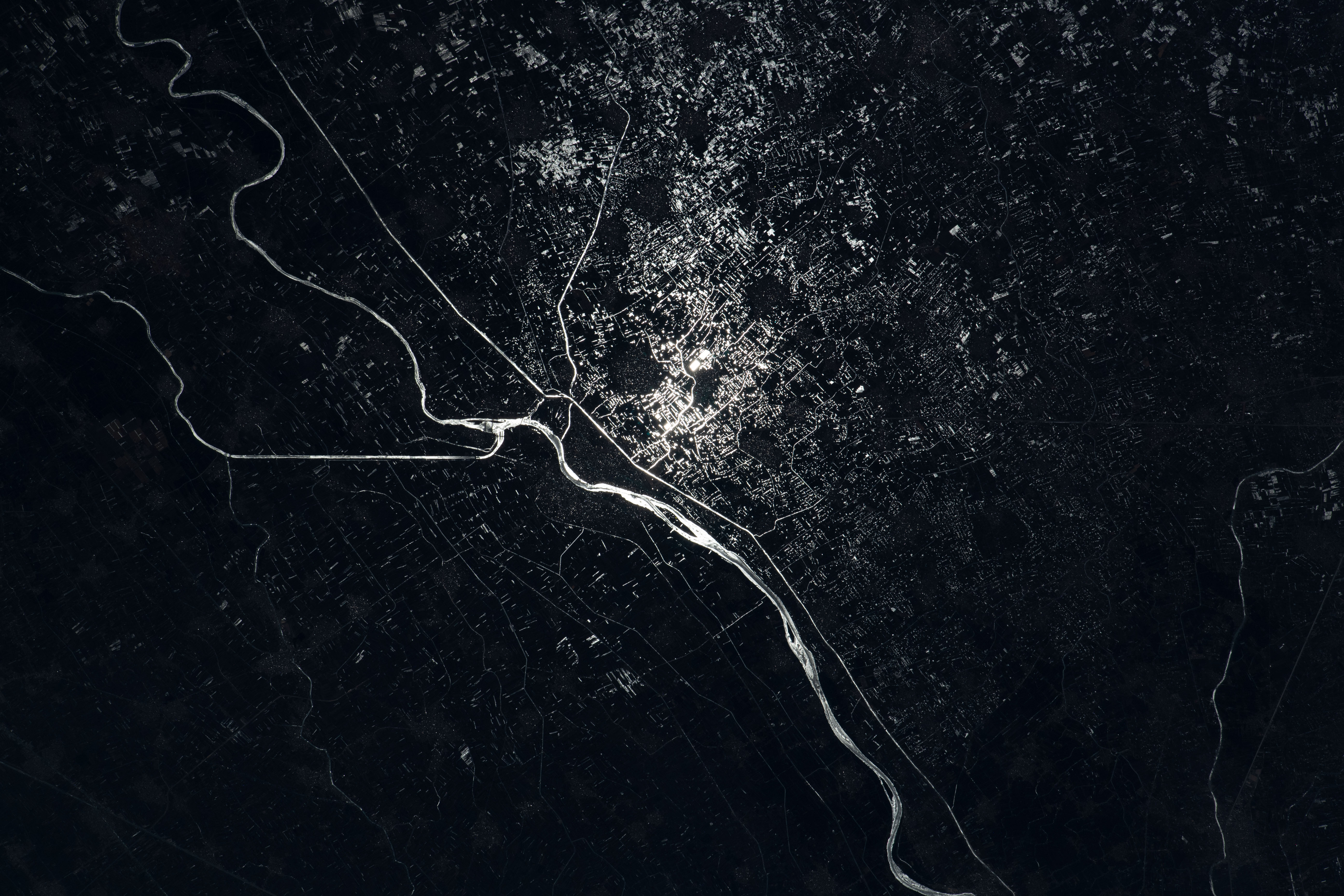 The Damietta Branch of the Nile River splits into canals in the central portion of the Nile Delta in Egypt. Lights from several cities surrounding the Egyptian waterways are pictured in this nighttime photograph from the International Space Station as it orbited 262 miles above the Mediterranean Sea off the coast of the Sinai Peninsula.