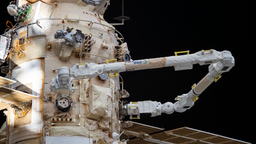 The European robotic arm (ERA) is pictured extending out from the Nauka multipurpose laboratory module during a mobility test several days after Roscosmos cosmonauts Oleg Artemyev and Denis Matveev activated the ERA during a seven-hour and 42-minute spacewalk.