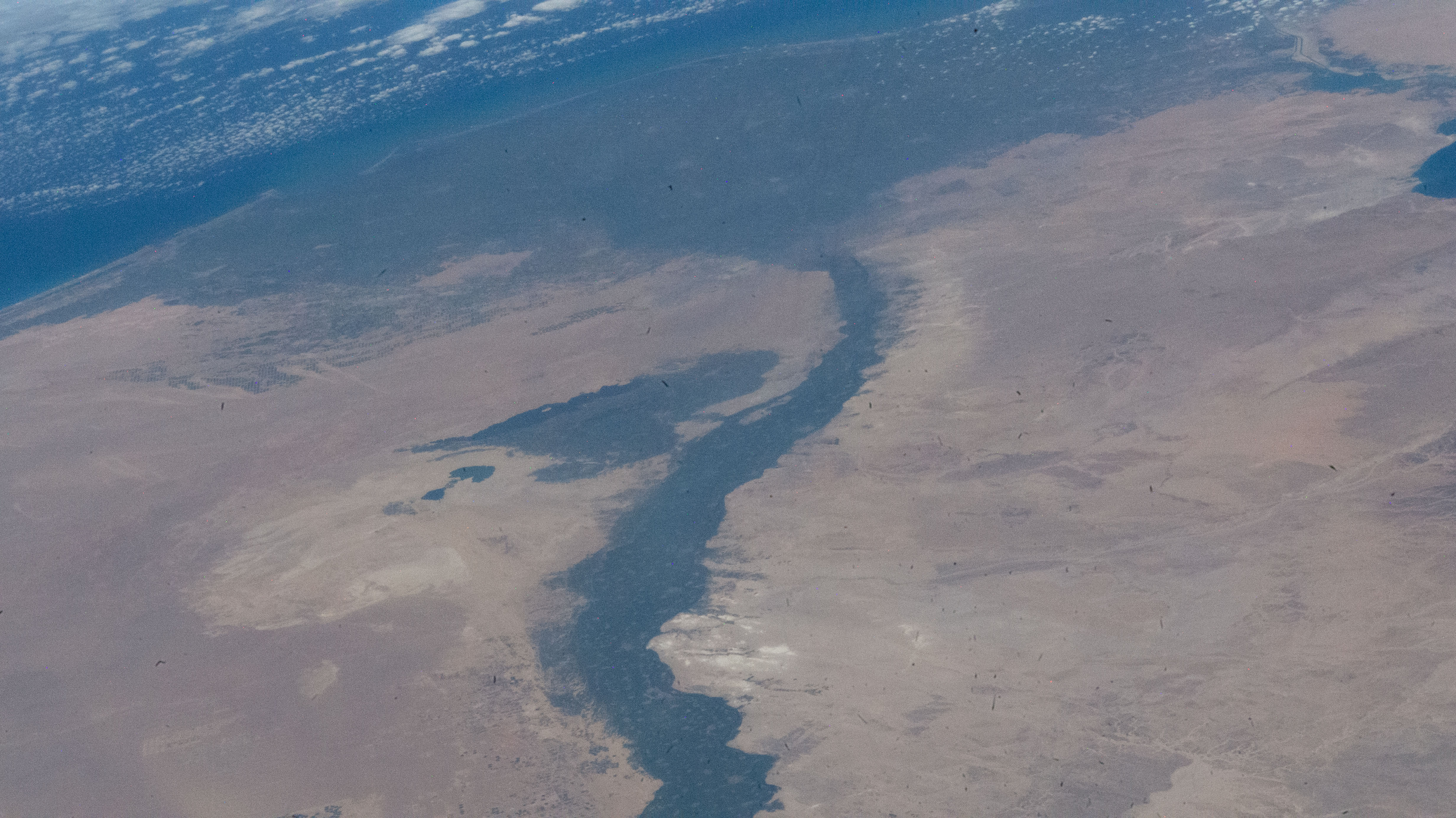 The Faiyum Oasis in Egypt extends to the immediate west of the Nile river which leads to the Mediterranean Sea in this photograph from an external high definition camera on the International Space Station as it orbited 262 miles above.